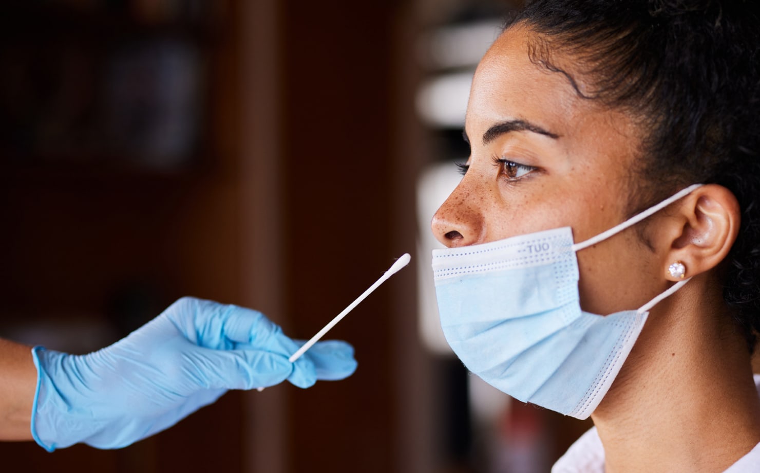 Adult receiving a COVID-19 test